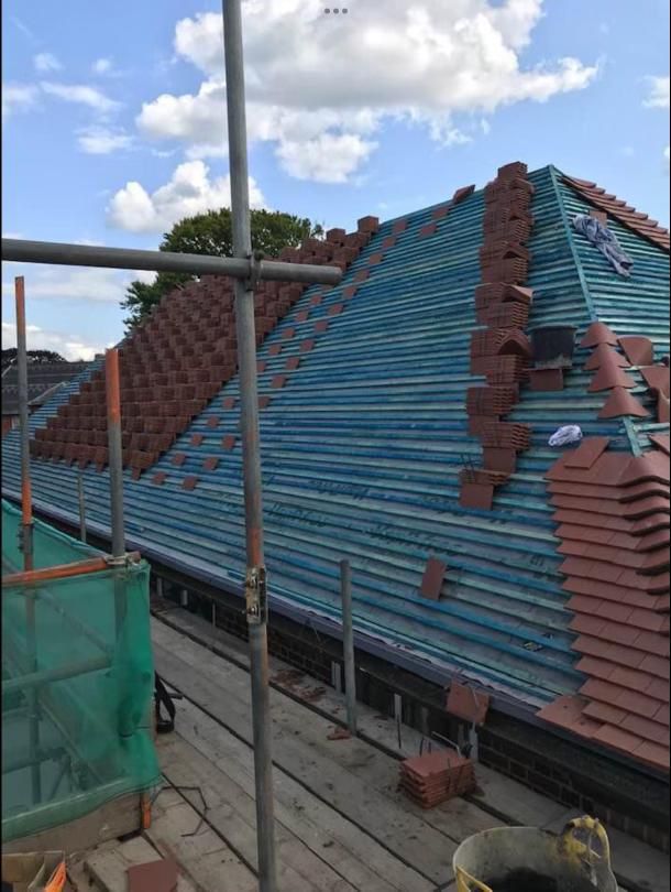 Roof mid-strip showing breathable membrane and stacked tiles in Richmond